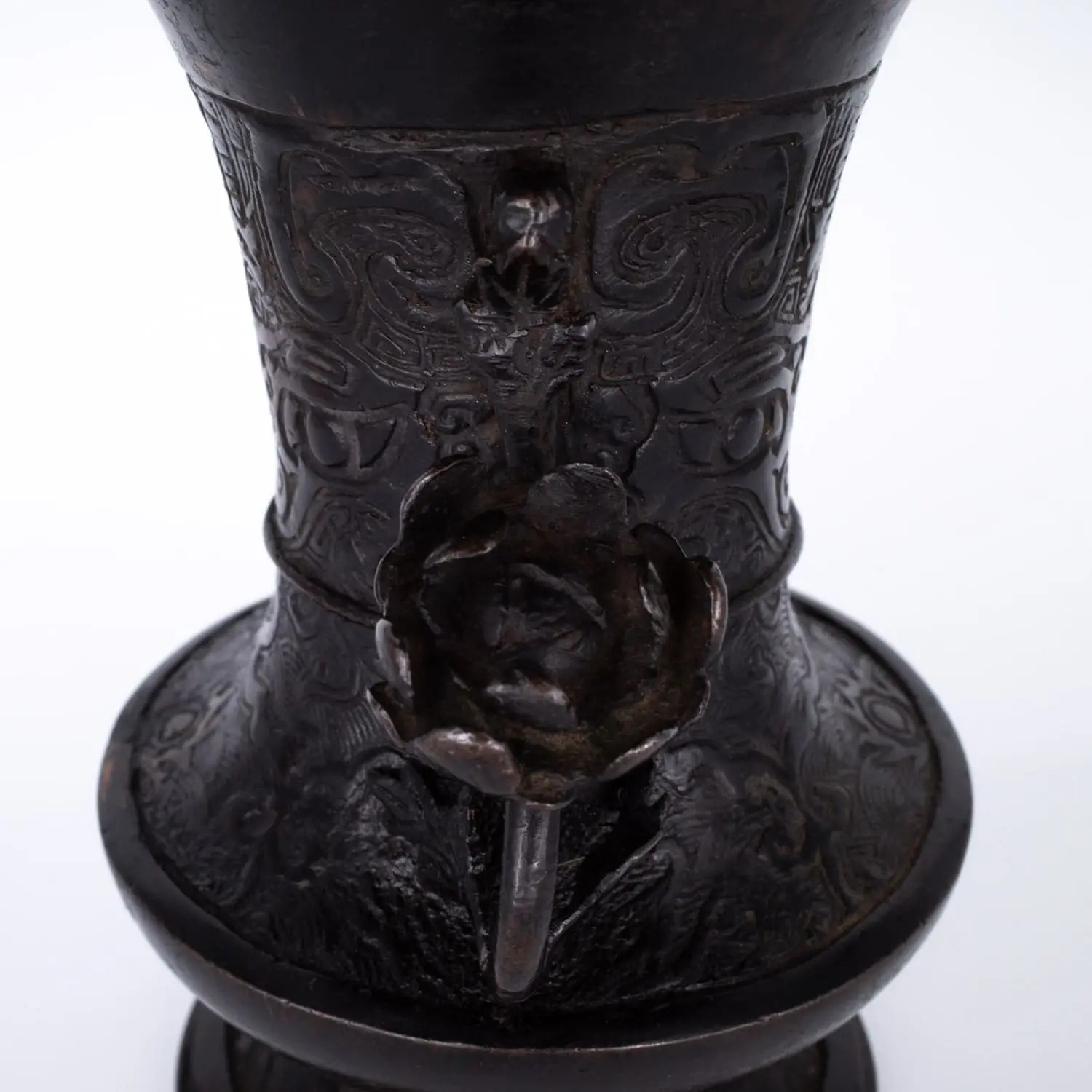 Antique Bronze Gu Form Altar Vase With Taotie Mask Decoration and Floral Handles. 19th century
