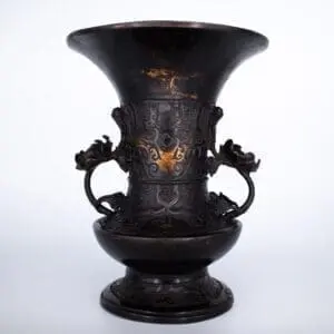 Antique Bronze Gu Form Altar Vase With Taotie Mask Decoration and Floral Handles. 19th century