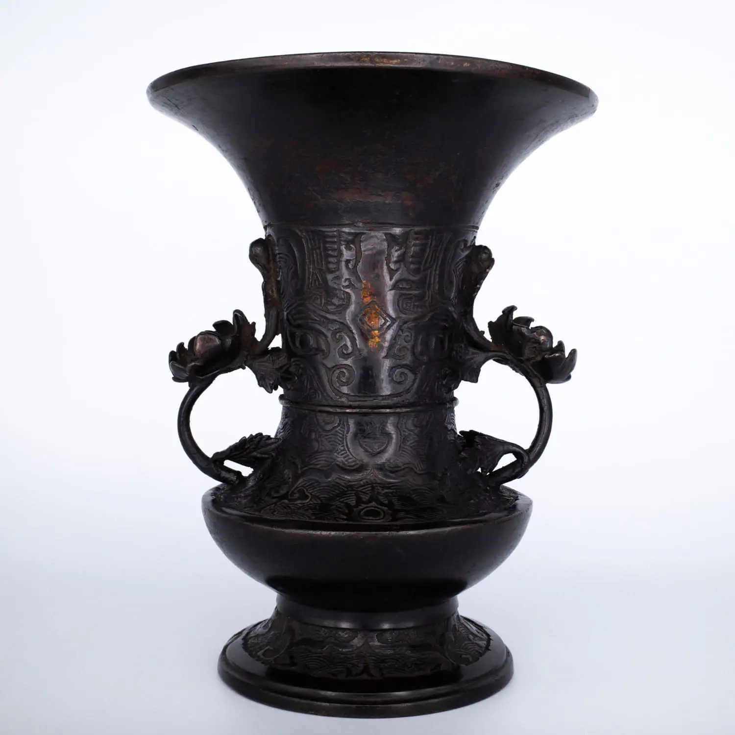 Antique Bronze Gu Form Altar Vase With Taotie Mask Decoration and Floral Handles. 19th century