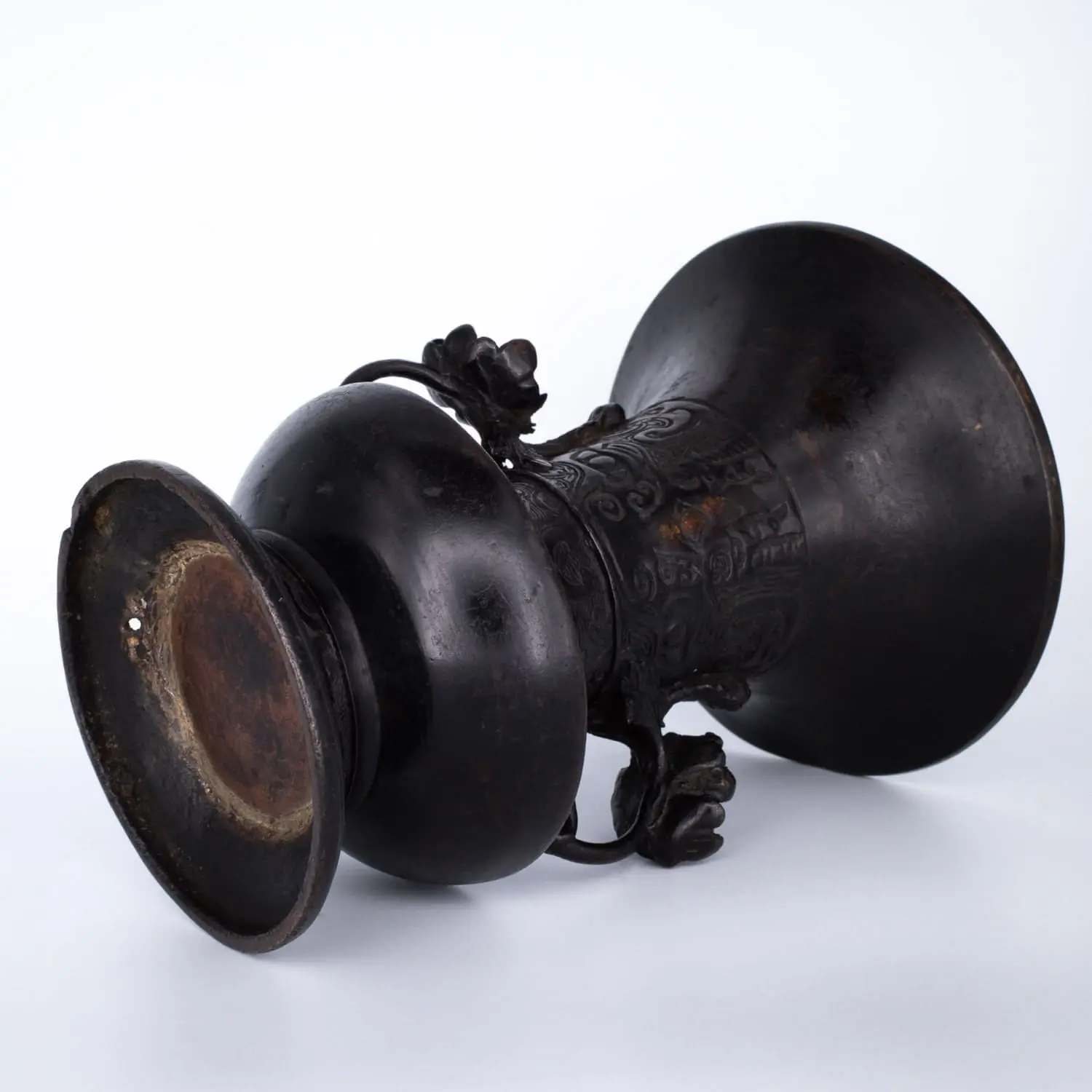 Antique Bronze Gu Form Altar Vase With Taotie Mask Decoration and Floral Handles. 19th century