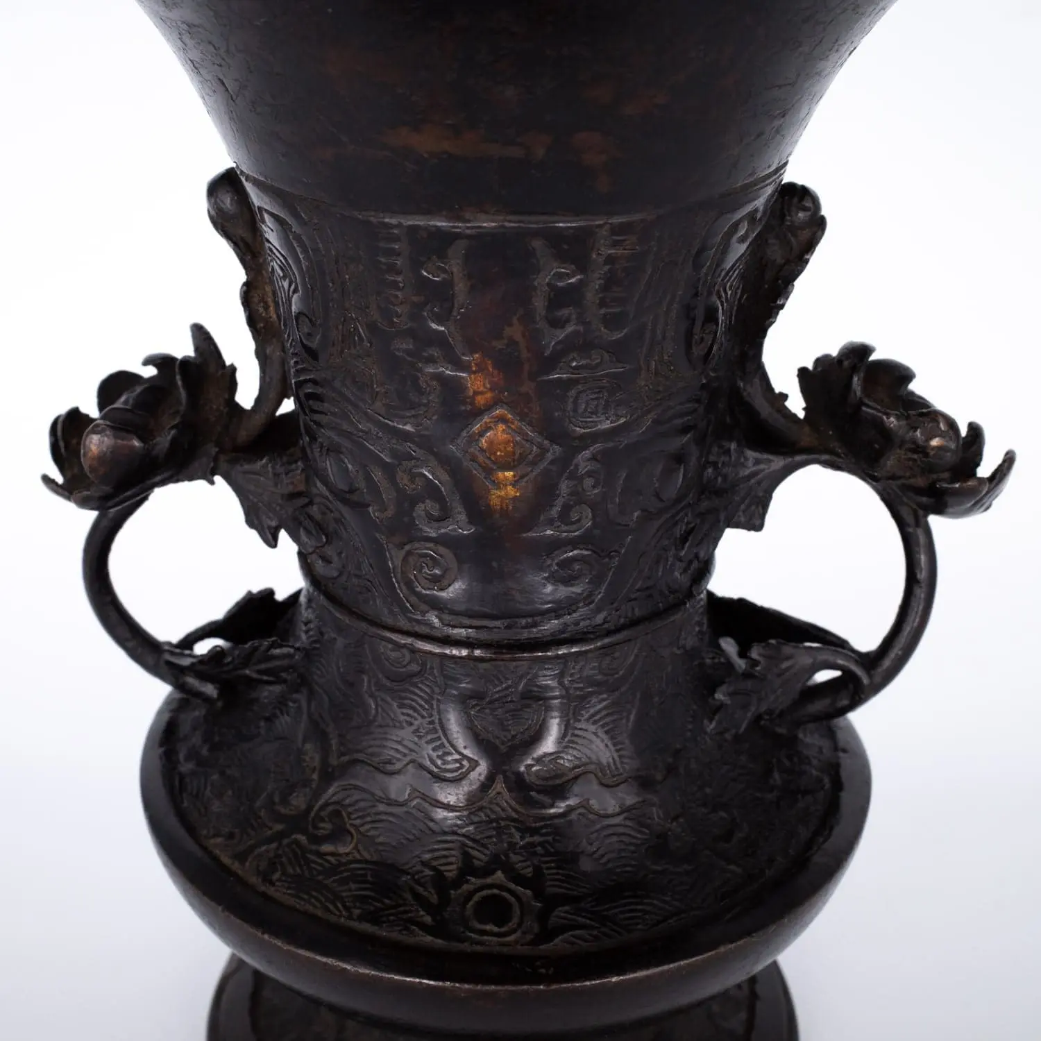 Antique Bronze Gu Form Altar Vase With Taotie Mask Decoration and Floral Handles. 19th century