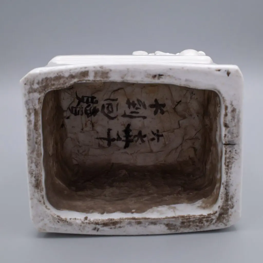 Dehua ('Blanc de Chine') porcelain foo lion joss stick holder, late 17th century, Kangxi period.