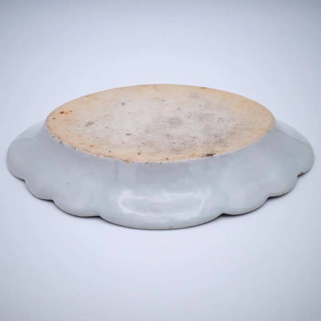 Oval blue and white decorated dish with landscape framed by Fitzhugh-type border, c. 1770.