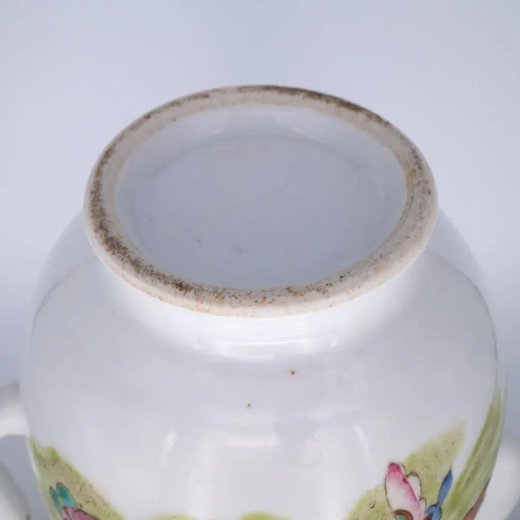 Famille rose decorated wine pot with butterflies, second half of the 19th century.