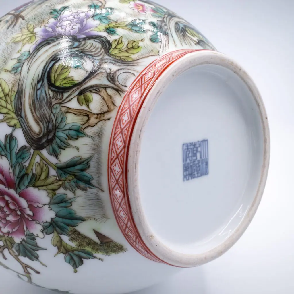 Later 20th century famille rose decorated vase with underglaze blue six-character Qianlong seal mark.