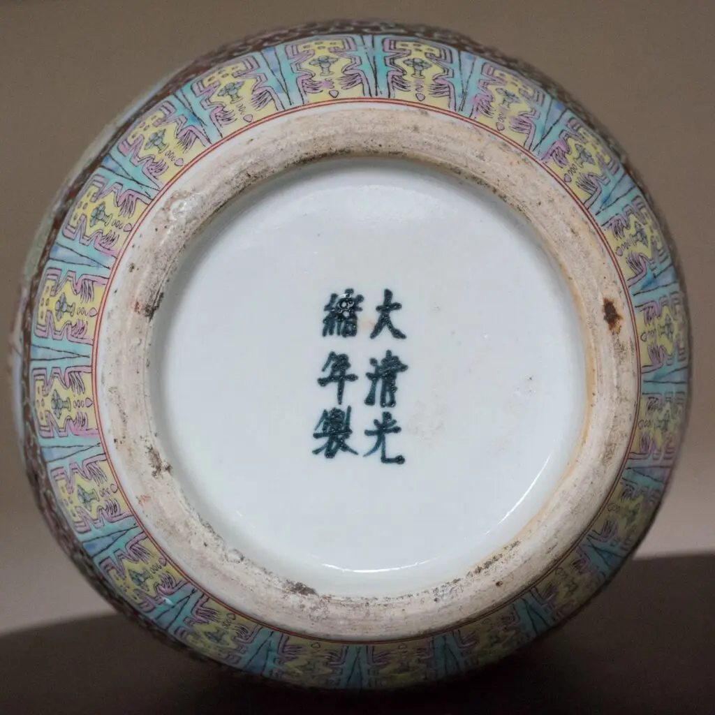 Partially transfer-printed PRoC famille rose decorated bottle vase with figural scenes and six-character Guangxu reign mark.