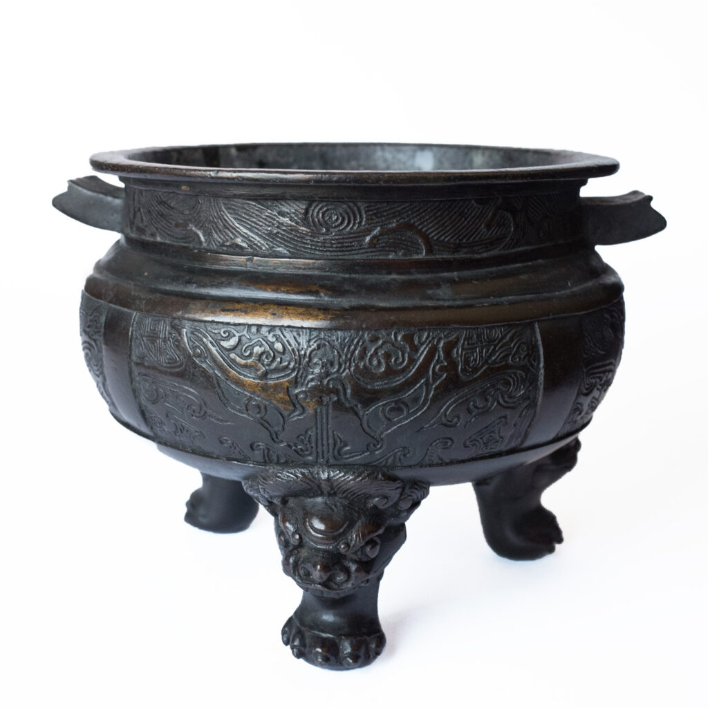 A Chinese Archaistic Bronze Tripod Censer With Taotie Mask Decoration