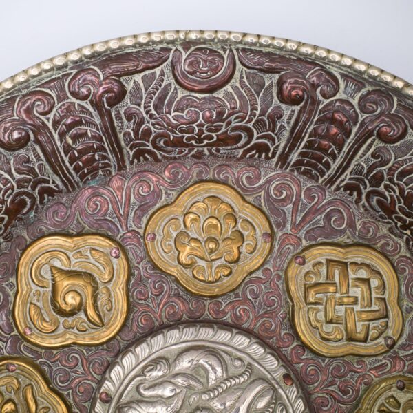 Large Tibetan Buddhist Copper Repousse Plaque With Silver Dragon and Astamangala in Brass. Diameter 33cm.