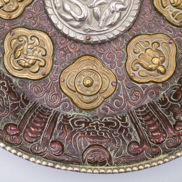 Large Tibetan Buddhist Copper Repousse Plaque With Silver Dragon and Astamangala in Brass. Diameter 33cm.