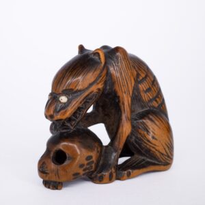 Antique Japanese Wooden Netsuke of a Wolf With a Human Skull. Edo Period, 19th century