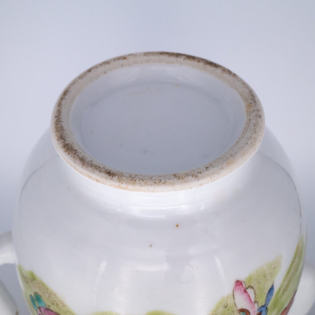 Famille rose decorated wine pot with butterflies, second half of the 19th century.